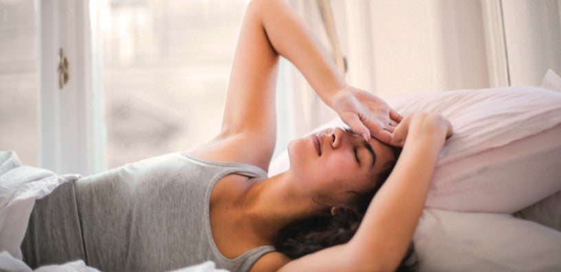 A woman having a hard time sleeping.