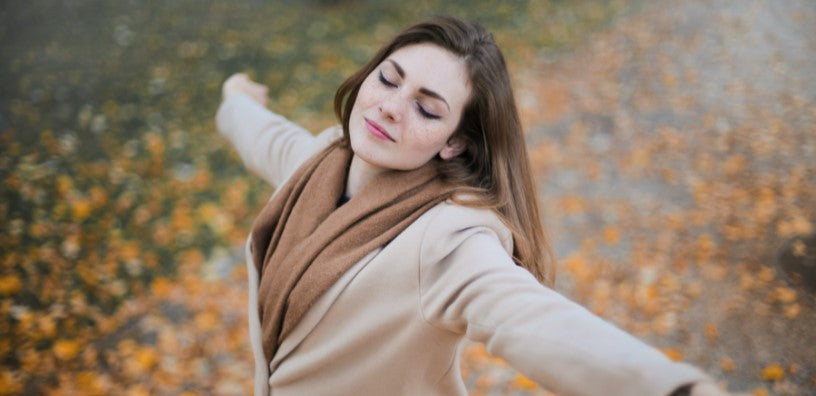 A woman is embracing the wind.