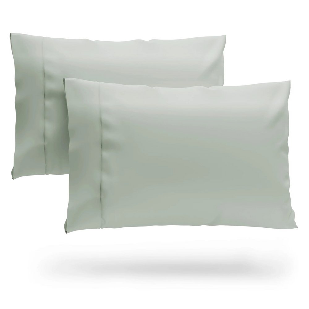 A pair of pillows covered with 100% Bamboo pillowcases.