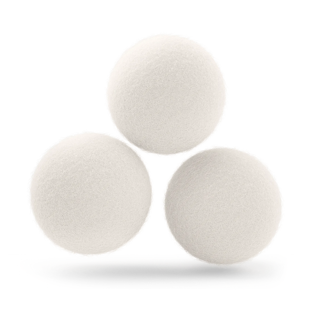 Three All Natural Wool Dryer Balls arranged like a triangle.